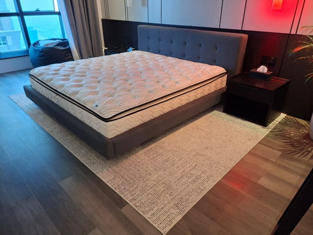 Apartment deep cleaning service in Dubai showing a bedroom after professional cleaning at Elite Residence Tower.